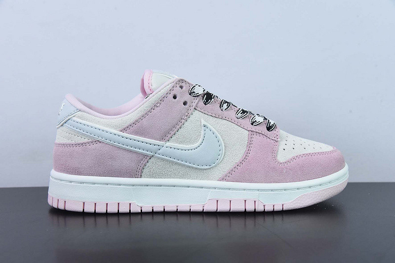 the nike dunk low appears in pink and grey suede dv3054-600